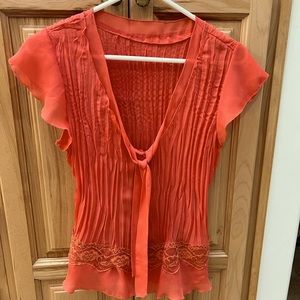 Sexy low cut coral sheer top.